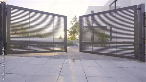 Garden Gate Opening to modern villa, modern house entrance sunshine Stock Video | Adobe Stock