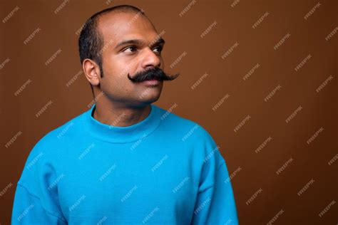 Premium Photo Face Of Indian Man With Mustache Wearing Blue Sweater