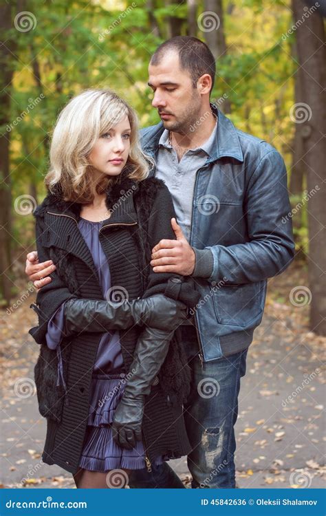 The Guy Holds The Girl By The Shoulders Stock Photo Image Of