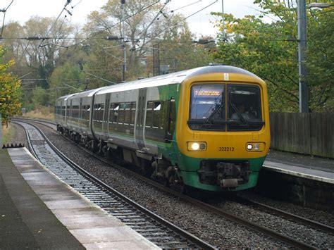 London Midland Class 323 323212 Draws To A Halt At Univers Flickr