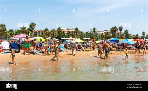 SALOU, SPAIN - AUGUST 3, 2017: Vacationers in the Llevant Beach in Salou, Spain. Salou is a ...