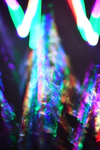 Multi Colored Laser Beam And Smoke With W Shape Closeup Stock Photo