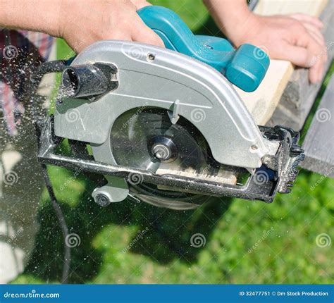 Handyman Using Hand-held Saw Stock Image - Image of outside, person: 32477751