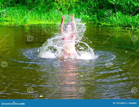 Brunette Girl Jumping With Splashes Stock Photo Image Of Hands Figure