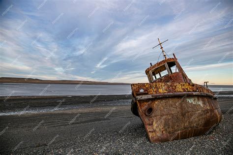 Premium Photo Old Rusty Boat Abandoned On Beach