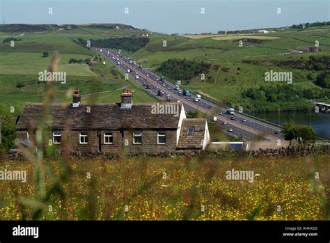 M62 Motorway At Scammonden Overlooking Moorland Farmhouse Stock Photo