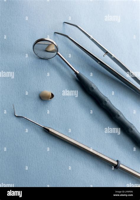 Set of dentist tools on blue background Stock Photo - Alamy