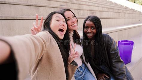 Happy Group Of Multiracial Young Women Taking A Selfie Portrait Smiling