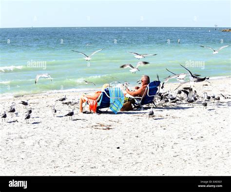 Mature Couple Sunbathing On Beach Hi Res Stock Photography And Images Alamy