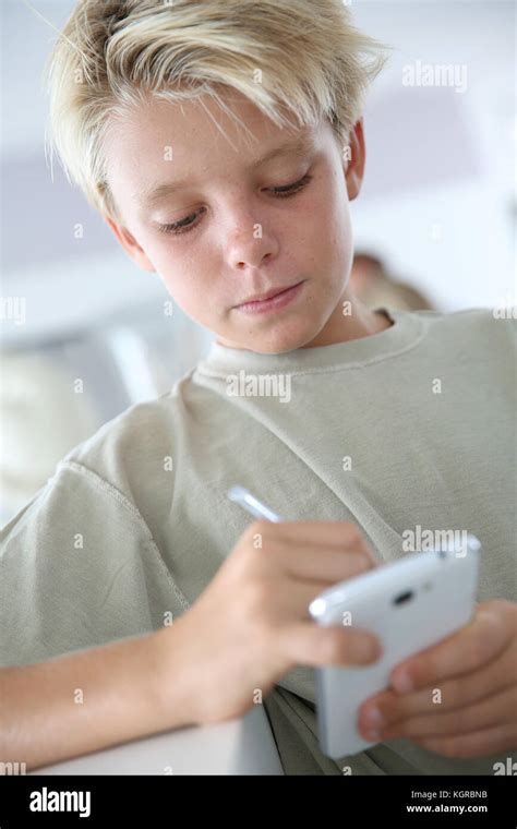 Young Boy Playing With Smartphone Stock Photo Alamy