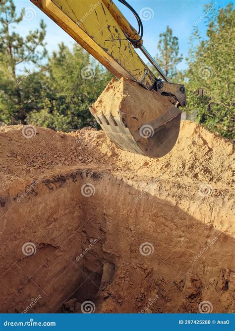 Digging The Pit Foundation A Hole With Excavator At The Construction