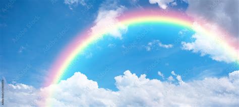 Rainbow in blue sky. Stock Photo | Adobe Stock