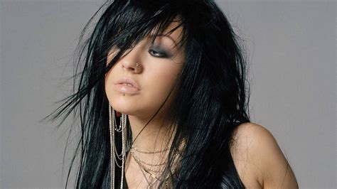 Photo Of Woman Wearing Black Sleeveless Top And Gold Colored Necklace