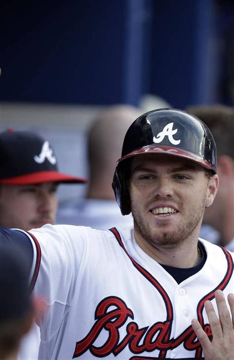 Atlanta Braves Freddie Freeman Celebrates In The Dugout After Hitting