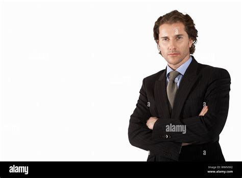 Businessman Standing With Arms Folded Stock Photo Alamy