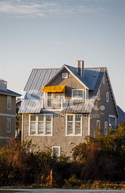 Grey Siding House With Yellow Awning Stock Photo | Royalty-Free ...