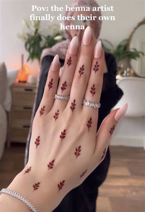 A Woman S Hand With Red Leaves Painted On It And The Words Pov The Hema