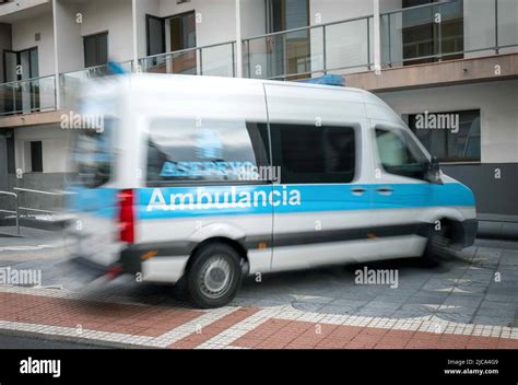 Spanish Ambulance Parked In Front Of Apartment Building Zoomed Stock