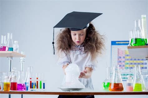 Premium Photo | Curious girl watching result of experiment in lab