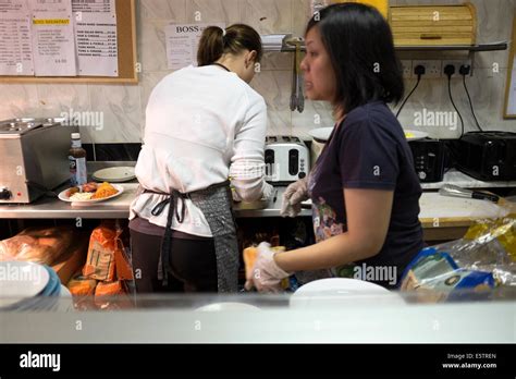 Workers Staff in Greasy Spoon Cafe making Breakfast Stock Photo - Alamy