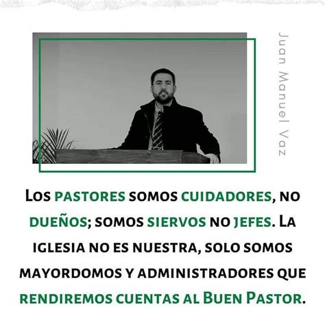 A Man Sitting At A Desk In Front Of A Sign That Says Los Pastores