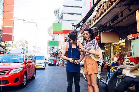 Couple Strolling Around Bangkok By Stocksy Contributor Lumina Stocksy