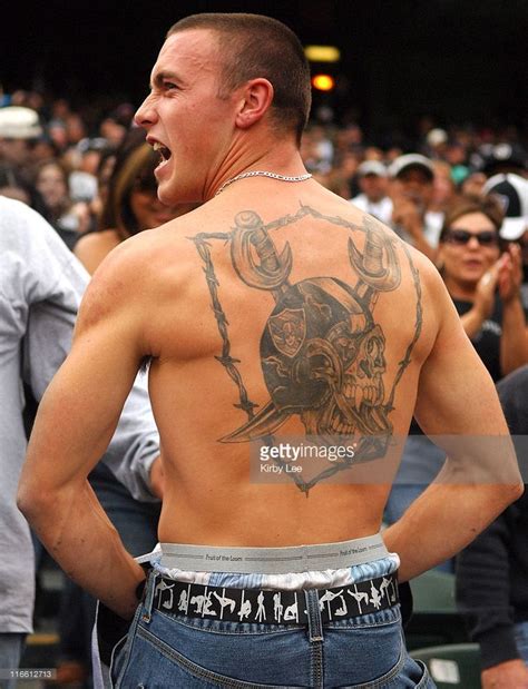 An Oakland Raider Fan Displays A Shield Logo Tattoo On His Back Oakland Raiders Fans