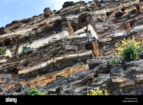 Geological Cliff Structures With Limestone And Soft Crumbling Oil