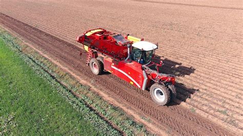 Premium Photo Harvesting Potatoes With A Combine Harvester