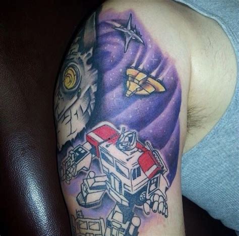 A Man With A Tattoo On His Arm Has An Image Of A Robot And Spaceship