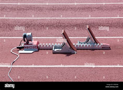 Empty track and field starting blocks Stock Photo - Alamy