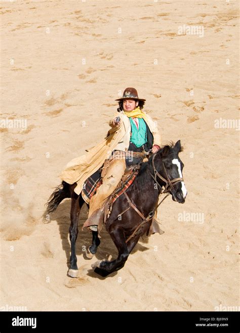 Cowboy On Horse With Gun