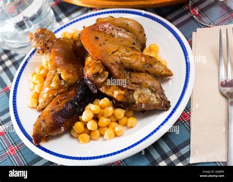 Spanish Dish Pies De Cerdo Con Garbanzos Stock Photo Alamy