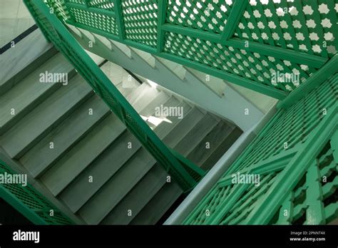 White Inside Stairs With Green Lattice Railings And Sunshine And