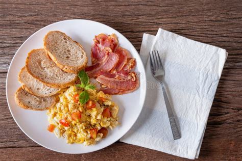 Homemade Breakfast Scrambled Egg With Tomato Sliced Bacon Grill And