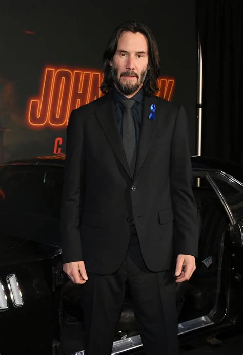 Keanu Reeves Honors Lance Reddick With Ribbon At John Wick 4 Premiere