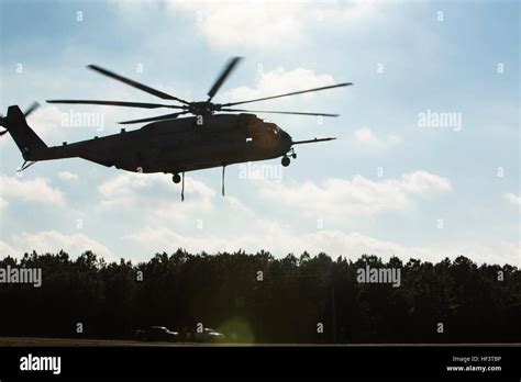 A U.S. Marine Corps CH-53 E Super Stallion helicopter prepares to lift ...