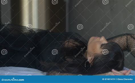 Pretty Brunette Woman In Black Lies On Bed And Poses Stock Video Video Of Girl Beautiful