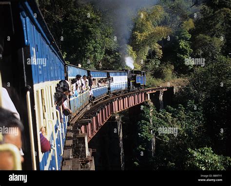 India, Nilgiri Blue Mountain Railway to Ootacamund, train crossing ...