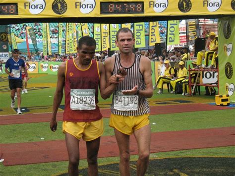 Blind Runner And His Guide Crossing The Finish Line At The Comrades