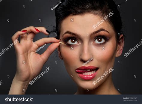 Sexy Brunette Putting Mascara Makeup Burnt Stock Photo