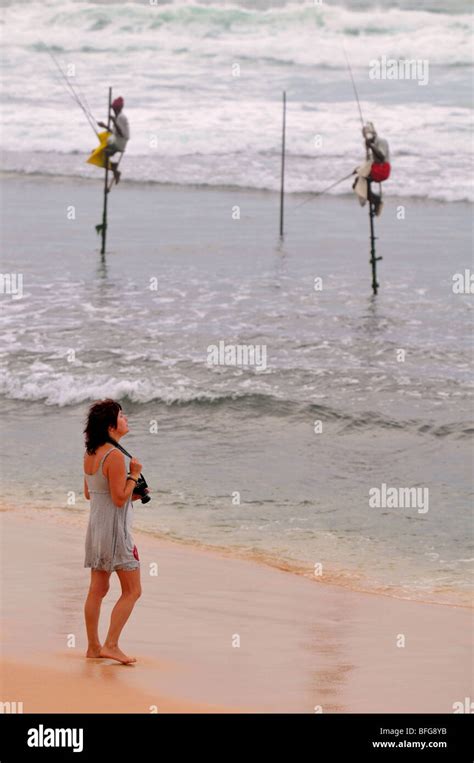 Stilt Fishermen Sri Lanka Tourist Taking Photographs Of Traditional