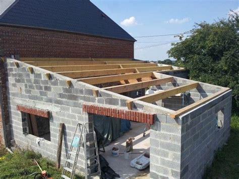 A House Under Construction With The Roof Up