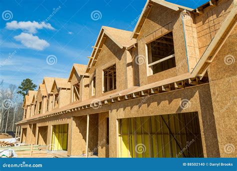 New Wood Townhouse Construction Stock Photo - Image of property ...