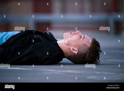 Man Lying On Ground High Resolution Stock Photography And Images Alamy