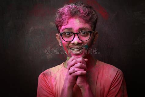 Portrait Of A Happy Smiling Boy With His Face Smeared With Colours