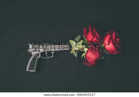 Gun And Rose Petals Over 241 Royalty Free Licensable Stock Photos