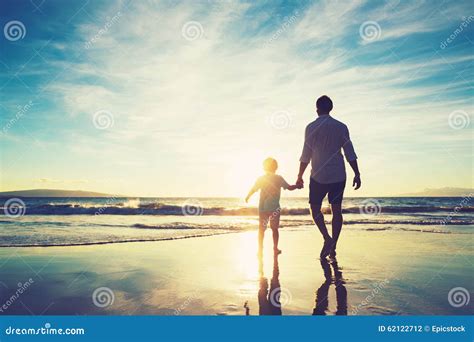 Father And Son Walking Together Holding Hands Stock Photo Image Of