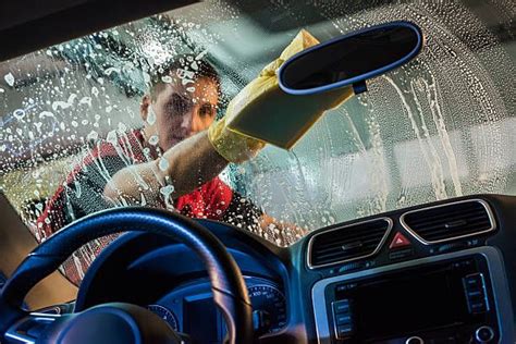 Male Car Wash Worker Foaming The Windshield Of A Car Best Car Wash