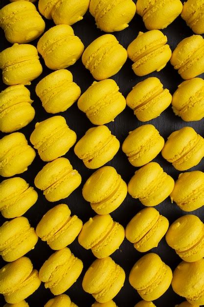 Premium Photo Mouth Watering Yellow Macaron Maccarone On Grey Tray